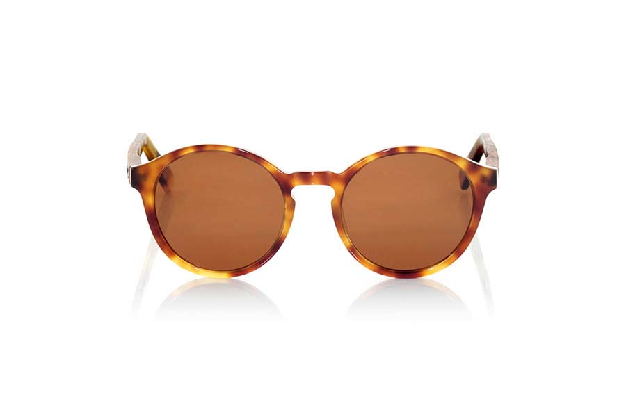 Wood eyewear of Rosewood AKTUA. AKTUA sunglasses of the MIXED PREMIUM series are manufactured with the quality colour tortoiseshell acetate front panel clear and sideburns in natural ROSEWOOD finished in Rod covered with acetate hawksbill that can be adjusted if necessary. It's a rounded suggestive shapes model that are perfectly to people of both sexes and have been combined in series with Brown lenses or orange REVO. The quality of the materials and their perfect completion will surprise you. Front size: 140x51mm for Wholesale & Retail | Root Sunglasses® 